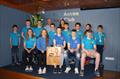 Proud Commodore Steven Kirby and club coach Debbie Hanna (back row) with the victorious East Antrim BC junior and youth squad with the prestigious 'Top Club' trophy won at the recent RYA-NI Youth Championship © Lucy Whitford