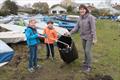 Victoria Lovell with Isaac Lovell and and Jack Addison cleaning the Emsworth SC boat park © Don Manson