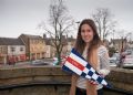 Graphic designer Chloe Taylor in Chipping Norton with her design of the yacht club's burgee © Trevor Taylor