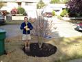 The author's wife, celebrating a successful tree planting in 2012 © David Schmidt