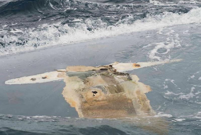 Cheeki Rafiki's upturned hull with the keel missing - photo © United States Coast Guard