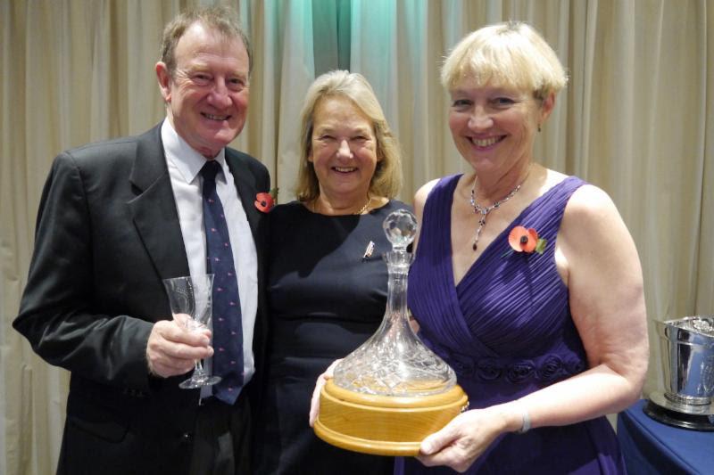 Russell & Helen Tribe received The Tanner Cruising Trophy from Maggie Widdop (centre) photo copyright Jennie Austen taken at Royal Southern Yacht Club