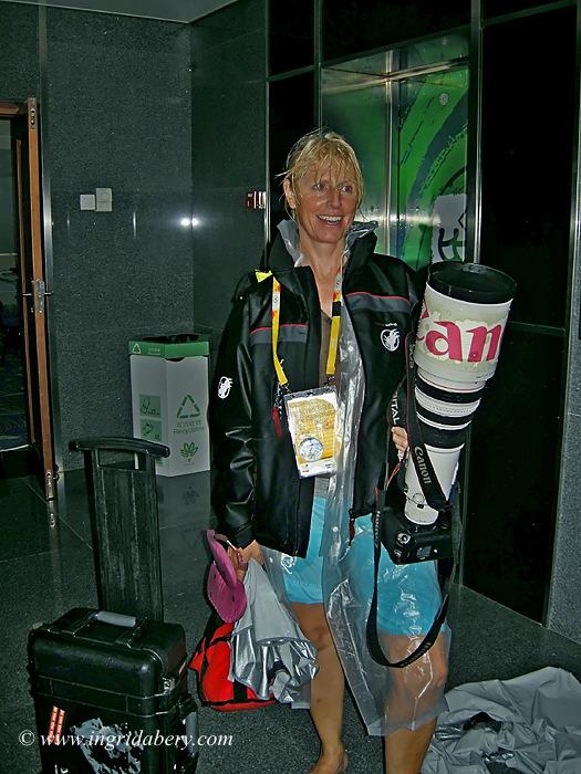 The glamourous side of sailing photography - Ingrid Abery on a very wet day in Qingdao! - photo © Ingrid Abery / www.ingridabery.com