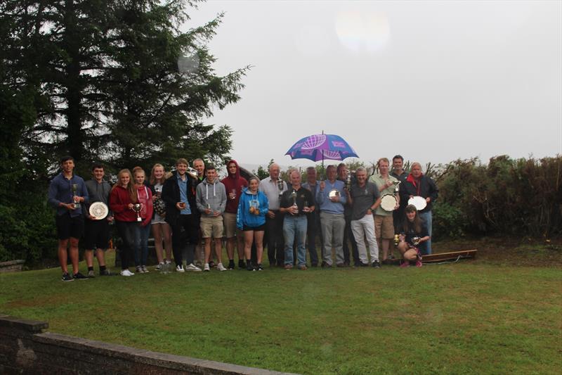 Soggy Sailors show off their trophies in the pouring rain at Solway YC Kippford Week photo copyright Beatrice Overend taken at Solway Yacht Club