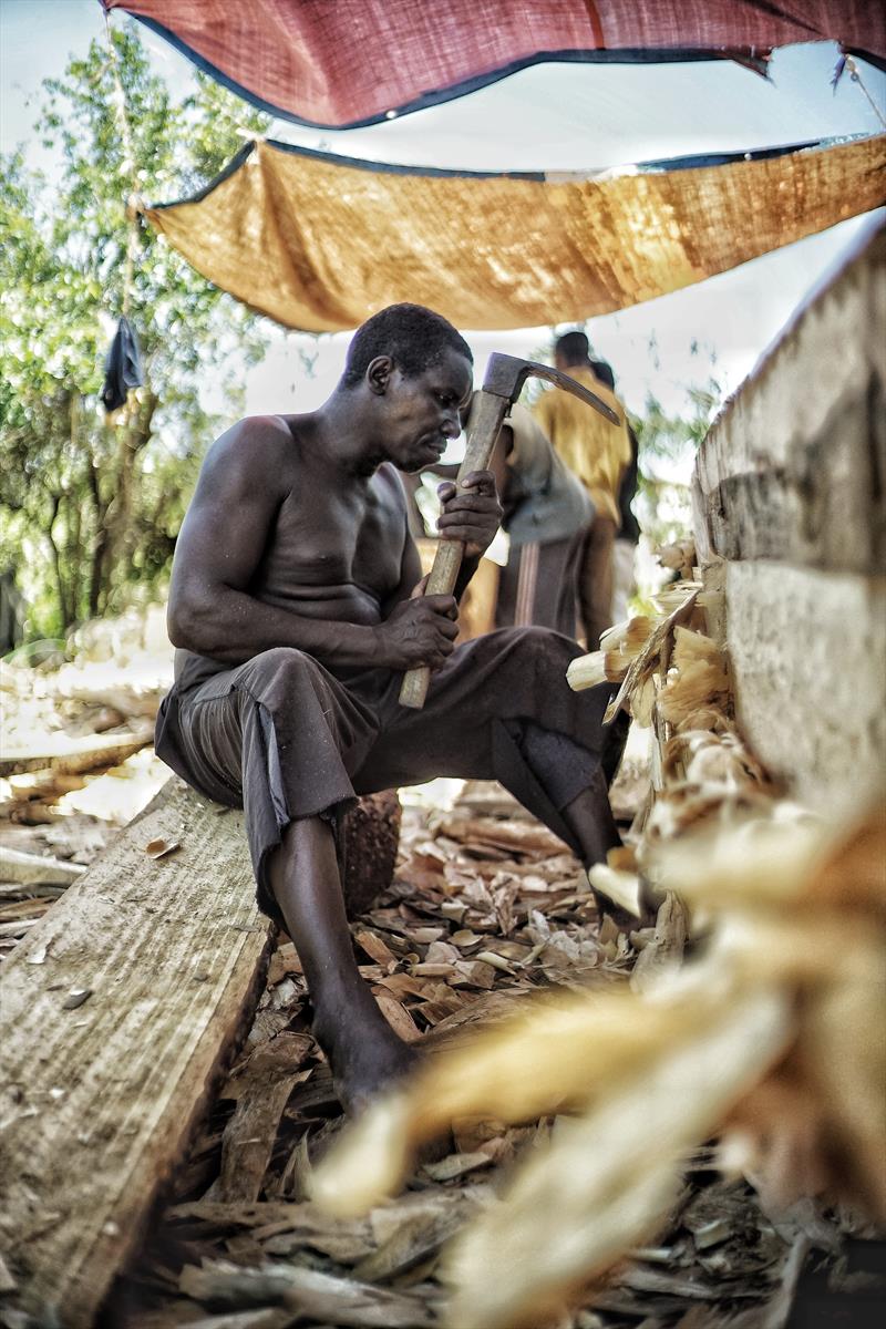 Local boat builder from Zanzibar carving one of the ngalawas for this year's Kraken Cup from a mango tree photo copyright Rahim Saggaf taken at 