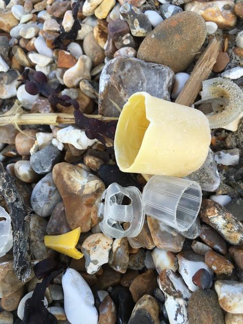 Bottle tops amongst the stones on Witterings Beach photo copyright Gael Pawson taken at 