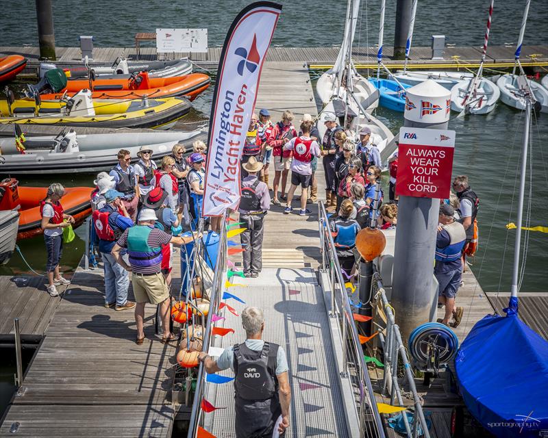 The volunteers receive their session briefing, led by Senior Instructor Rev Peter Salisbury on the 35th Anniversary of Royal Lymington Yacht Club's Wednesday Junior Sailing programme - photo © Alex Irwin / www.sportography.tv