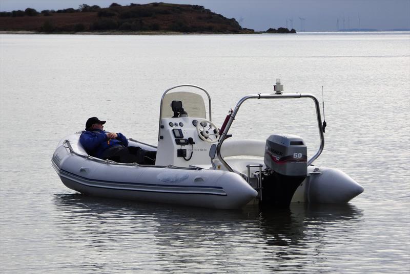 Safety Boat Driver, keeping warm and taking it easy with precious little to do waiting for the race to start during the Solway Yacht Club Bumfreezer Series  photo copyright Solway YC taken at Solway Yacht Club