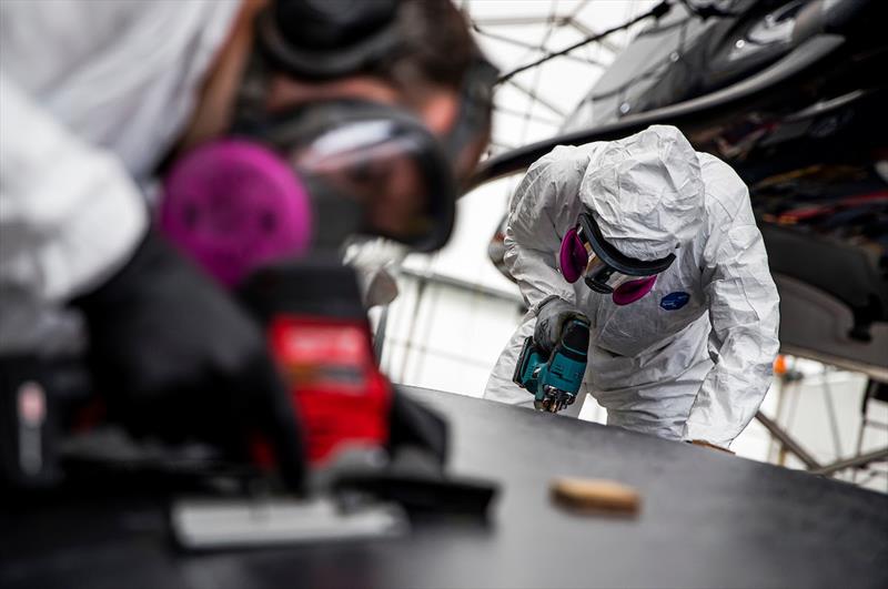 The replacement panel that was fabricated at the Emirates Team New Zealand facility is cut to fit into PATRIOT's port-side hull - photo © Sailing Energy / American Magic