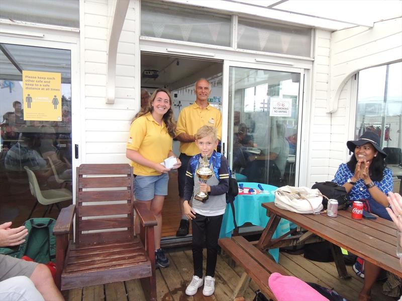 Louis Strowger receiving the Endeavour Award from Commodore Holly Hancock and Vice Commodore Will Penny after the Horning SC Junior Regatta, OnBoard Festival & Bart's Bash Race photo copyright Holly Hancock taken at Horning Sailing Club
