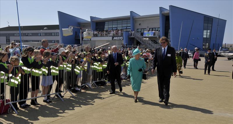 WPNSA Chairman Edward Leask escorts Her Majesty the Queen photo copyright Geoff Moore taken at Weymouth & Portland Sailing Academy