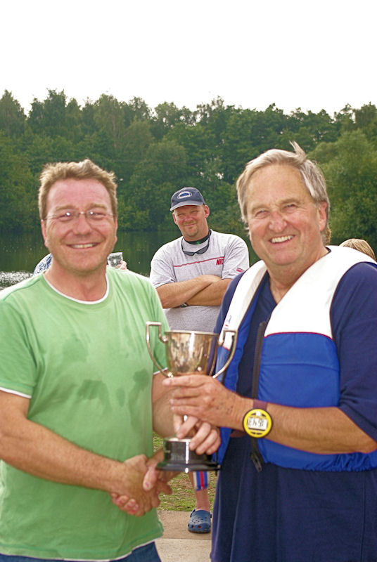 Andy Chapman (right) receives the MPSC Commodore Cup for 2010 from Dave Higgins photo copyright Lee Bratley taken at Manor Park Sailing Club