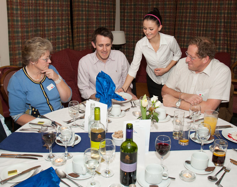 Gill Stuart of Tredington, Neil Fisher of Banbury, and David Wilbrahams of Witney at the Inaugural Dinner of the Chipping Norton Yacht Club being served by Alex New photo copyright CNYC taken at Chipping Norton Yacht Club