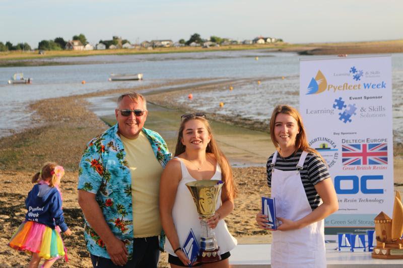 Mark White presents Rebecca Bines (c) and Connie Hughes (l) with the Big Wednesday Cadet Trophy at Learning & Skills Solutions Pyefleet Week photo copyright William Stacey taken at Brightlingsea Sailing Club