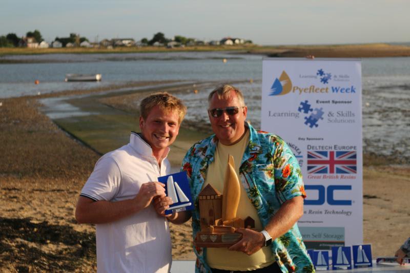 Mark White presents Ben Clegg (L) with the beautiful Pyefleet Week Big Wednesday Trophy at Learning & Skills Solutions Pyefleet Week - photo © William Stacey