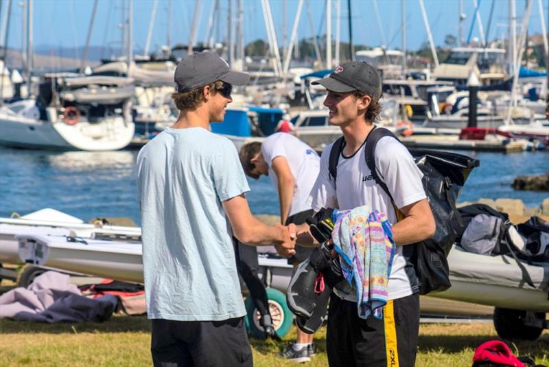 Laser Radial competitors Otto Henry (left) & Zac Littlewood wish each other ‘good sailing’ before today’ racing. Littlewood (WA) is leading series, Henry is third overall in his first season in Radials after sailing 420s - Day 3, Australian Youth Sailing photo copyright Beau Outteridge taken at Royal Yacht Club of Tasmania