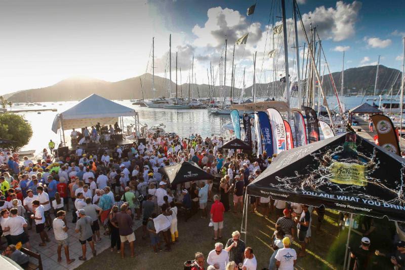 Crews enjoy discussing their race at the daily prizegivings held on the lawn at Antigua Yacht Club - 2019 Antigua Sailing Week photo copyright Paul Wyeth taken at Antigua Yacht Club