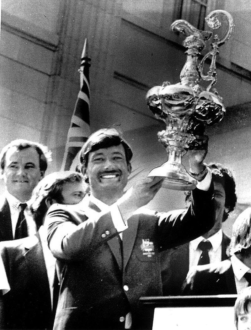 Hoisting the Auld Mug aloft after winning the 1983 America's Cup photo copyright Event Media taken at New York Yacht Club