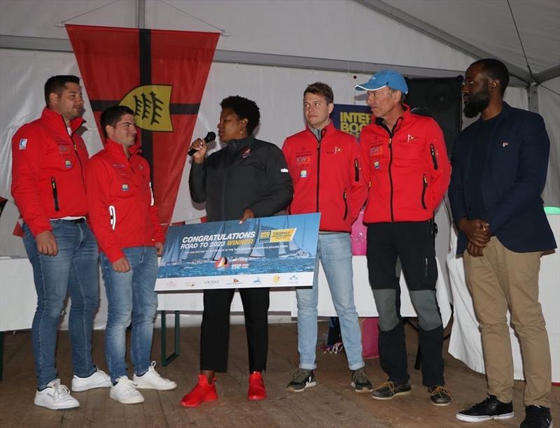 Events and Marketing Manager Rana Jamila-Lewis and Sean Matthew from the UK Antigua and Barbuda Tourism Authority Office presenting the grand prize to team Kai - photo © Antigua Sailing Week