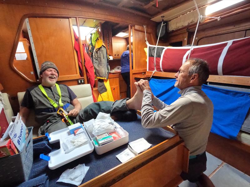 Doctor Patrick Bodiou is checking that Skipper Mark Sinclair, aka Captain Coconut, still has all his toes. On board Explorer AU (28) (OGR2023 Sayula Class Entry) - photo © OGR2023 / McIntyre Adventure