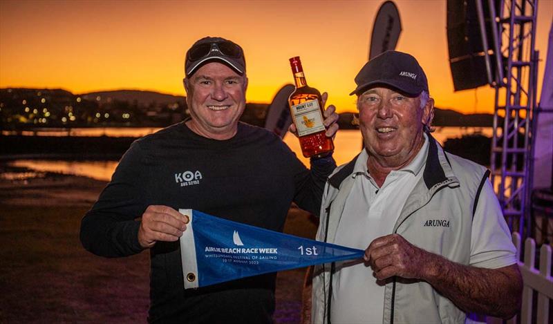 Steve McConaghy (left) and Mark Tolhurst pick up their first place spoils - Airlie Beach Race Week photo copyright VAMPP Photography taken at Whitsunday Sailing Club