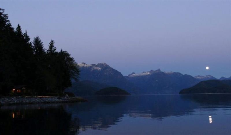 Near perfect reflection of the moon and snow-capped mountain tops to the left. Impressive, given that it is September and we are at sea level photo copyright Riviera Australia taken at 