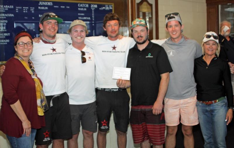 Charlie Welsh (black shirt center) celebrates with his team after winning California Dreamin' Series. Welsh is joined by regatta Co-Chairs Lisa Meier (far right) and Cindy Bambam (far left) photo copyright Rick Roberts taken at Long Beach Yacht Club