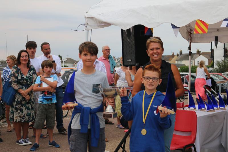 Cadet Handicap winners Oscar Oldfield and Tom Philips receive their prizes from Sue Bouckley of Learning & Skills Solutions photo copyright James Stacey taken at Brightlingsea Sailing Club