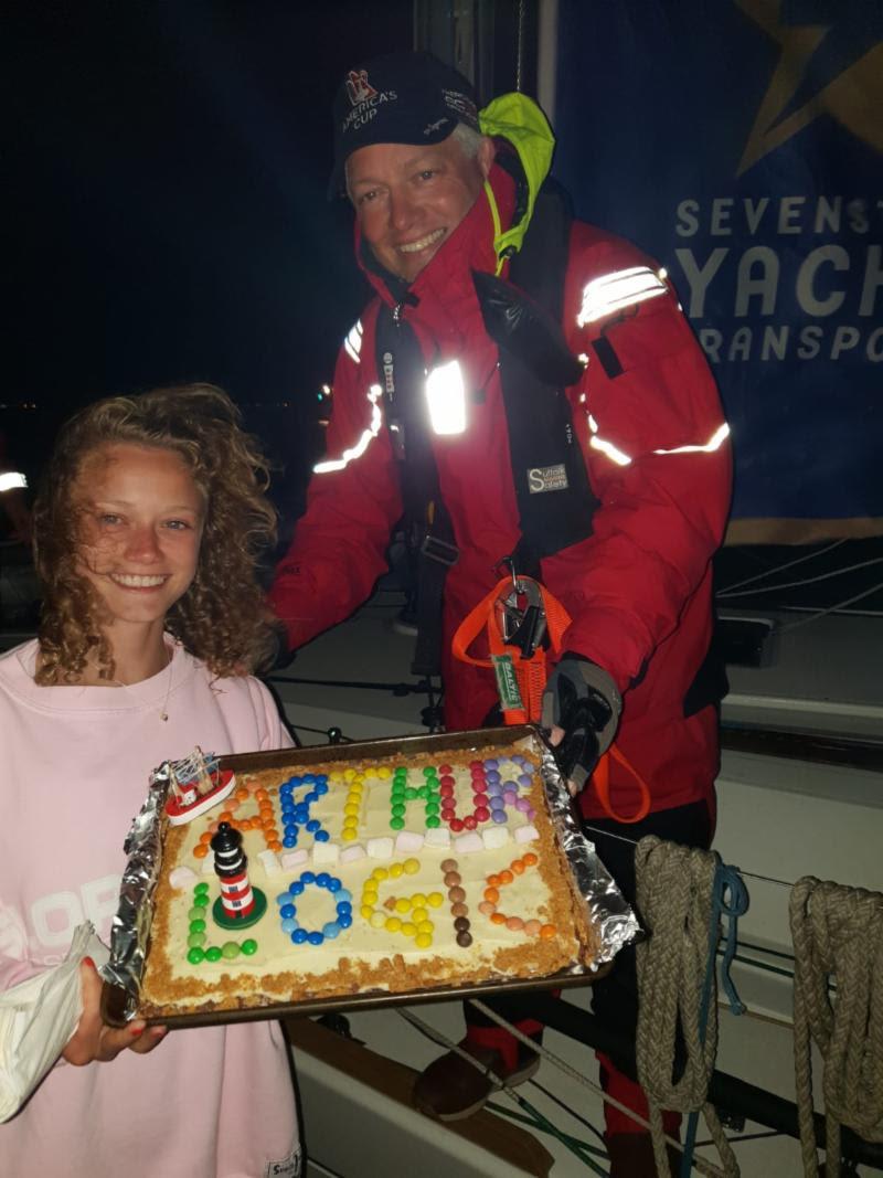 Mike Irwin, doctor on board Arthur Logic, receives a huge welcome home and cake baked by his daughter Hannah - photo © Arthur Logic