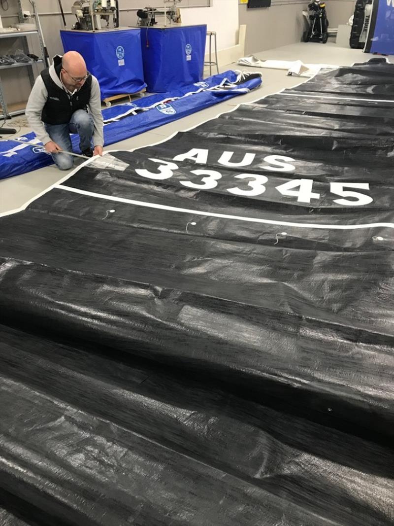 Stewart Gray checks a sail at the North Sails Loft at Cambridge, Tasmania photo copyright Stewart Gray taken at 