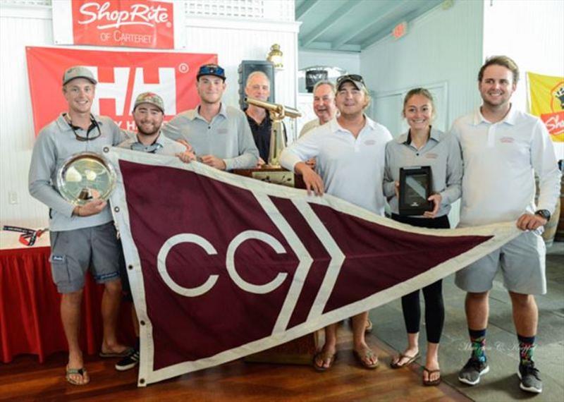 College of Charleston posing next to Paul Hoffmann Trophy for Best Overall Performance. Standing behind them are Peter Becker (L, representing Young American Sailing Academy, owner of J/105 that Charleston raced), and Paul “Binky” Hoffman, Jr. on right - photo © Maureen Koeppel