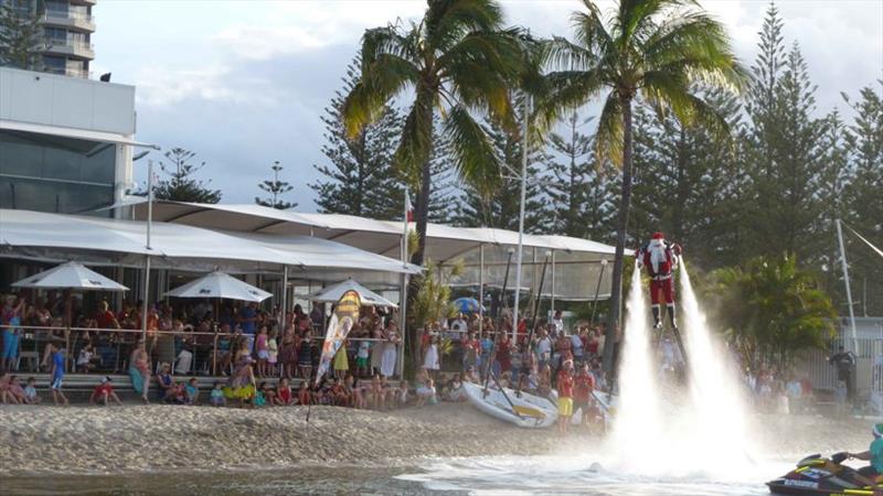 Santa arriving via JetPack Events, at Southport Yacht Club's 2017 Carols on the Broadwater celebrations at the Club's Main Beach Facility. - photo © Southport Yacht Club