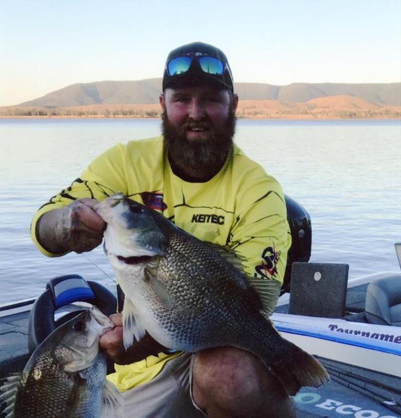 Aussie angler Daniel McCoy caught and released 4.45-kg Australian bass (Macquaria novemaculeata) on August 18, 2018 while fishing Lake Somerset in QLD, Australia. McCoy played fish for 15 minutes on 6-pound test line after it hit lure he was casting photo copyright IGFA taken at 