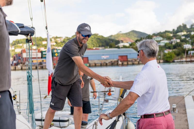 Eddie Warden Owen, RORC CEO congratulates Trevor Middleton, Black Sheep - 2018 RORC Transatlantic Race photo copyright RORC / Arthur Daniel taken at Royal Ocean Racing Club