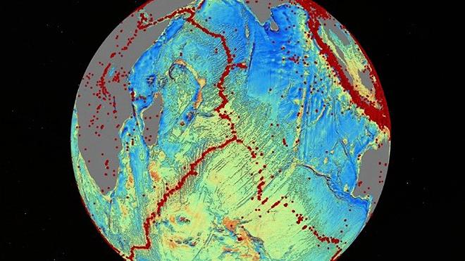A version of Dr. Sandwell's sea floor map reveals details about earthquakes (red dots), sea floor-spreading ridges and faults photo copyright Dr. David Sandwell / UCSD taken at 