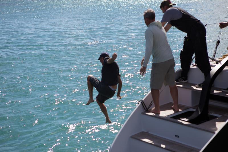 At least the water is warm! John Gallagher gets thrown by his crew after completing the 2019 RORC Caribbean 600 photo copyright RORC / Arthur Daniel taken at Royal Ocean Racing Club