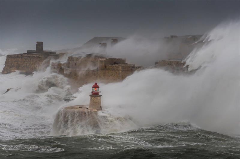 70kt storm hits Ricasoli Breakwater Lighthouse in Valletta, Malta. February 24, 2019 photo copyright Kurt Arrigo taken at Royal Malta Yacht Club