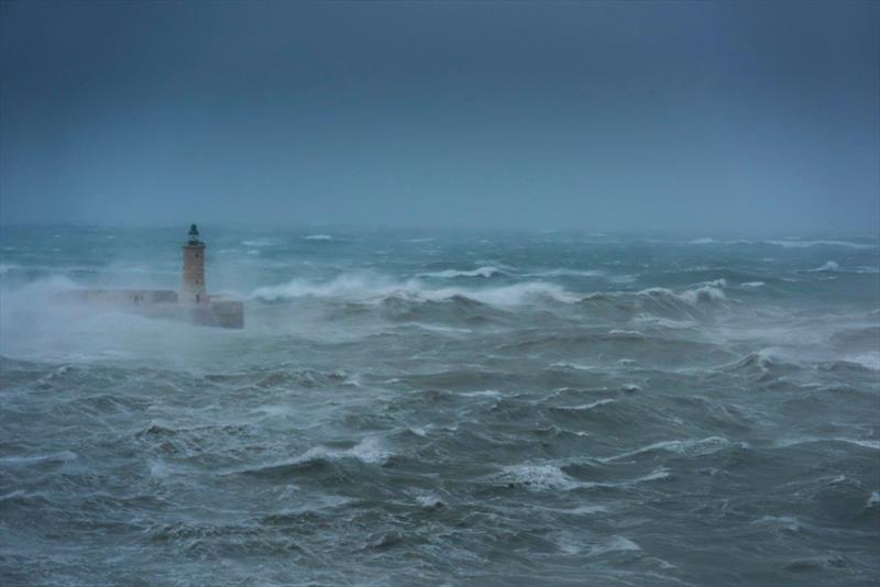 70kt storm hits Ricasoli Breakwater Lighthouse in Valletta, Malta. February 24, 2019 photo copyright Kurt Arrigo taken at Royal Malta Yacht Club