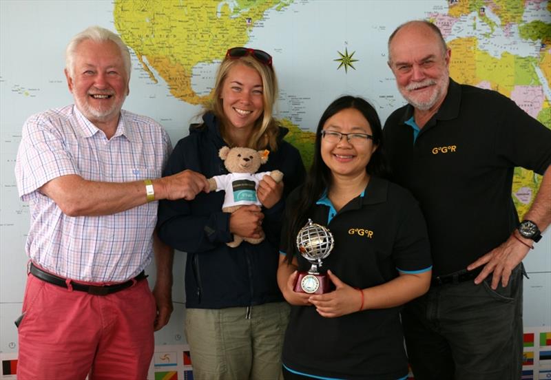 Left to right: Stuart Keane returning the SITraN Teddy to Suzy Goodall accompanied by Race organisers Jane and Don McIntyre photo copyright Tina Martin / PPL / GGR taken at 