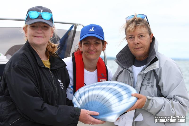 Marie Claude Heys, accompanied by Paul Hey's daughters Gemma and Natalie, release a seashell containing Paul Hey's ashes into the Solent photo copyright Tim Wright / www.photoaction.com taken at Royal Southern Yacht Club