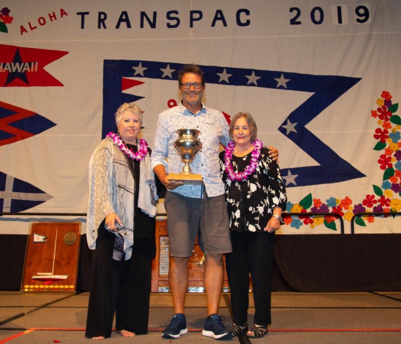 Dallas Kilponen from Kialoa II receiving the Burla Trophy with Michele Burla Parker and Pam Burla - Transpac 50 - photo © Sharon Green / Ultimate Sailing
