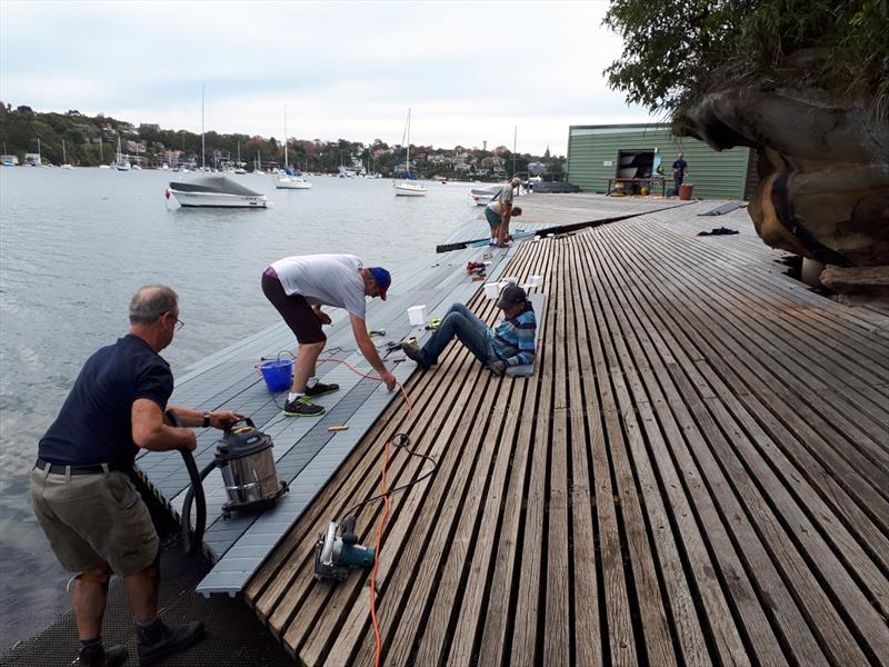 Members during a working bee before the shed (visible in the background) was burnt down photo copyright Harry Fisher taken at Lane Cove 12ft Sailing Skiff Club