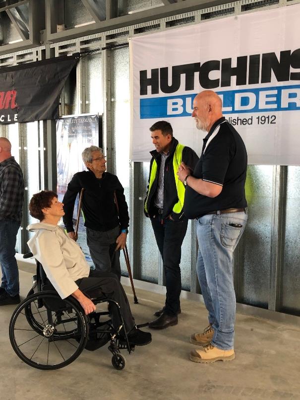 Julie Pearson and Bert Somssich talk with Hutchinson Builders Jamie Washington and Pat Donlan photo copyright Jane Austin taken at 