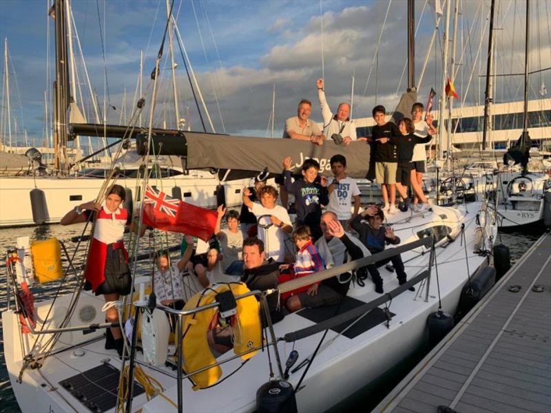 Children from the sailing school at Real Club Náutico de Arrecife climbed on board Richard Palmer's JPK 10.10 Jangada. They asked questions about what it's like to race two handed across the Atlantic Ocean photo copyright RORC taken at Royal Ocean Racing Club