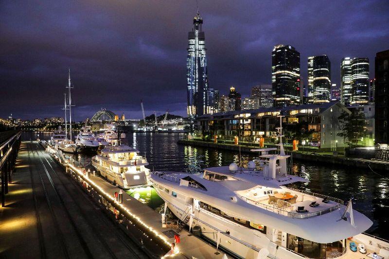 The line up of superyachts looking just as spectacular after sunset photo copyright AIMEX taken at 