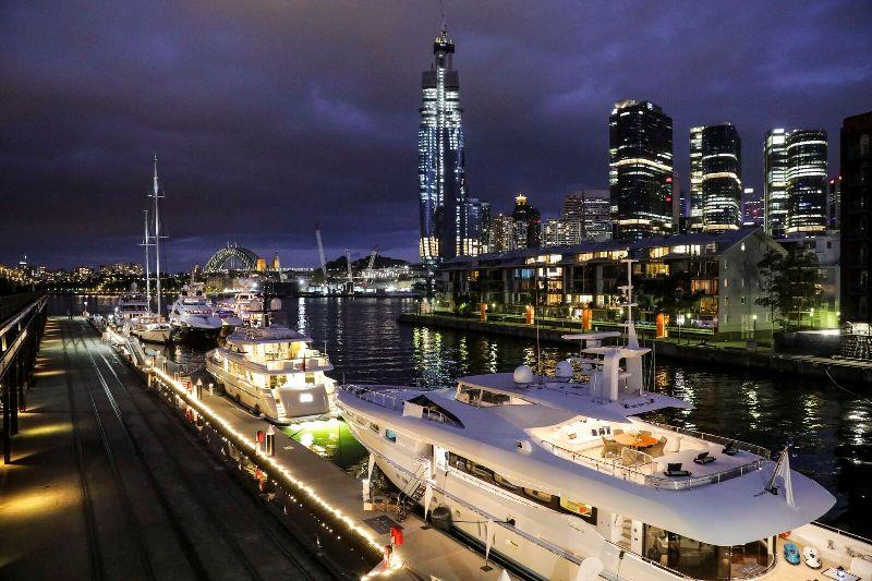 The line up of superyachts looking just as spectacular after sunset. - photo © AIMEX