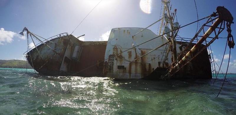 Derelict vessel on coral reef photo copyright Pacific Coastal Research and Planning taken at 