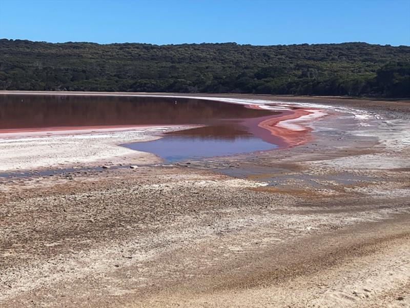 The pink lake, Lake Hillier is only about 100 meters inland from the turquoise blue waters of Middle Island Bay and provides a stunning and unexpected contrast in the landscape photo copyright Wooden Boat Shop taken at 