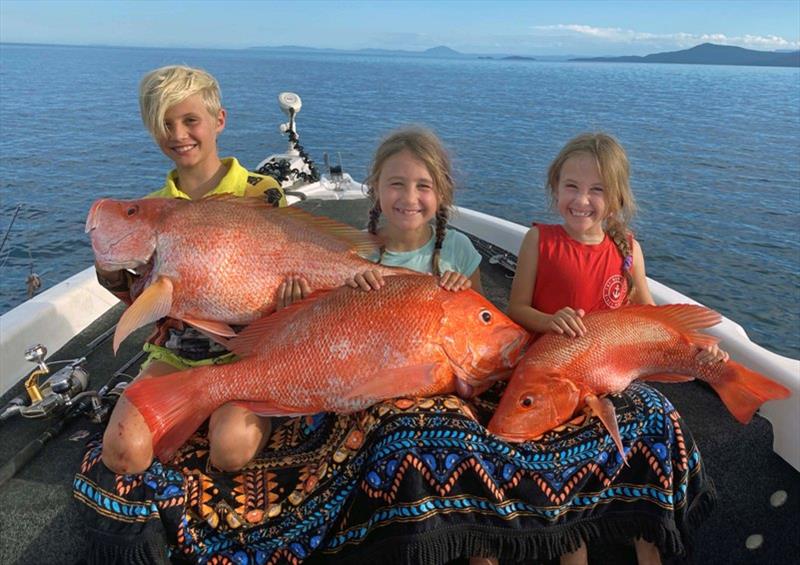 Minjaia Welham and children with nannygai and coral trout photo copyright Ryan Moody taken at 