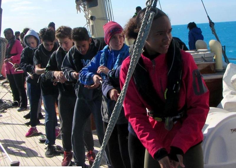 All pulling together aboard the Spirit of Bermuda - photo © Bermuda Sloop Foundation